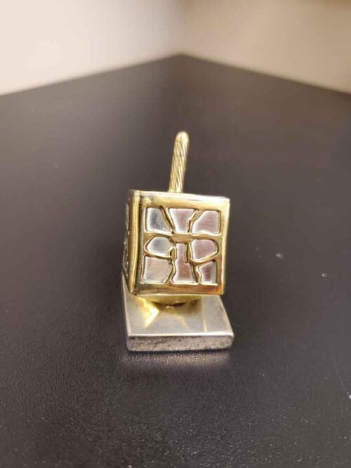 Silver and gold dreidel with stand